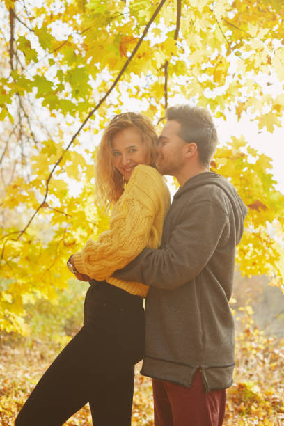 istock Young couple in love in autumn forest 1069903776