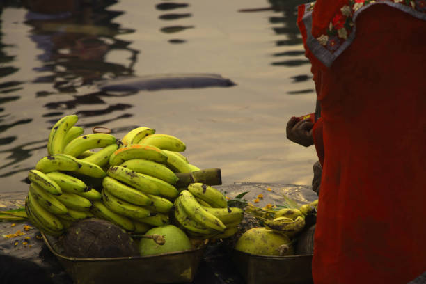 istock people gathered at river bed and offering fruit and vegetable to sun god 1069907620