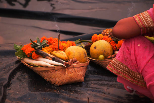 istock people gathered at river bed and offering fruit and vegetable to sun god 1069908574