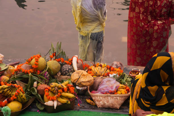 istock people gathered at river bed and offering fruit and vegetable to sun god 1069909302