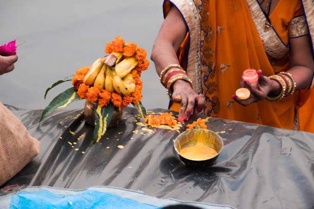 istock people gathered at river bed and offering fruit and vegetable to sun god 1069910506