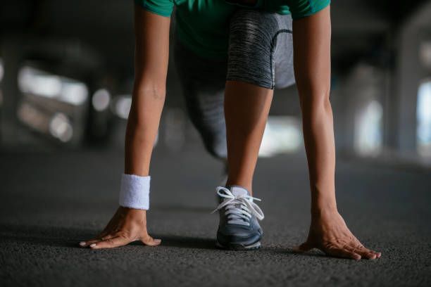 istock Young woman running outdoors 1069913408