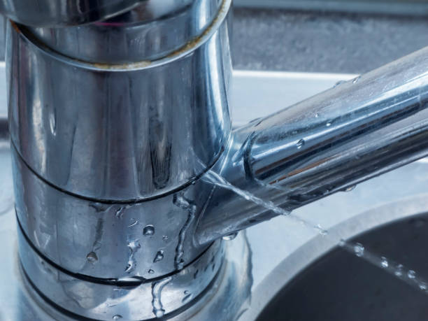 istock defective faucet close up 1069919198