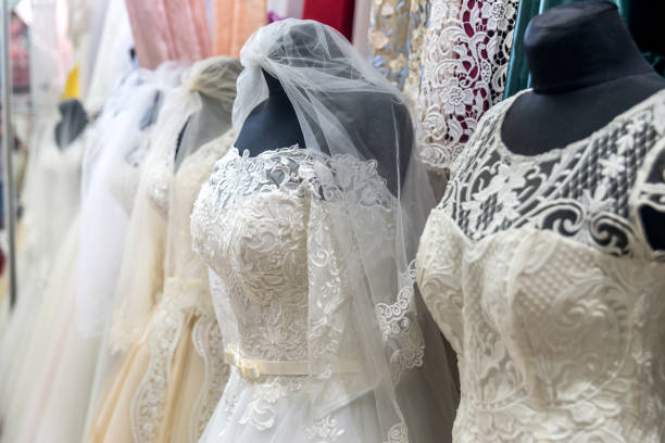 istock Dresses for bride in wedding salon on mannequins 1069925140