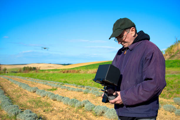 istock Farmer inspecting cultivated land with drone 1069931648