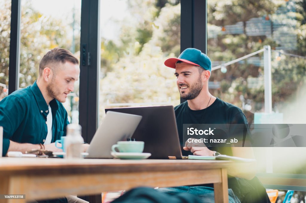 Young kiwis in business. Millennial at work from a coffee shop in Auckland, New Zealand. New Zealand Stock Photo
