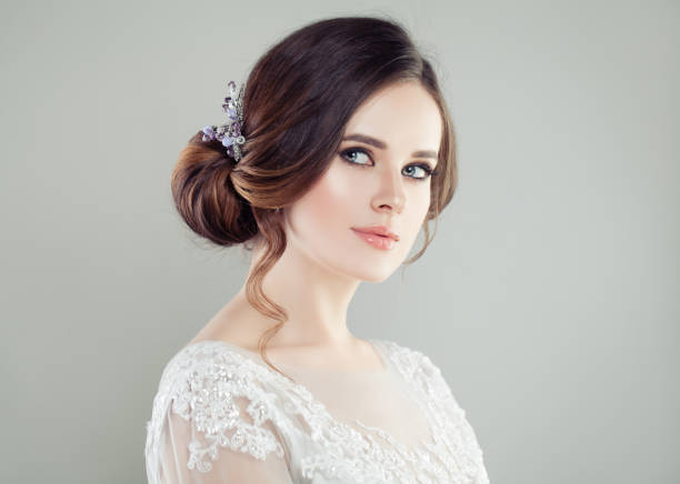 istock Cute bride with makeup and bridal hairstyle, face closeup 1069934192