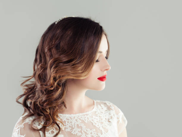 istock Attractive woman with makeup and curly hairstyle 1069935472