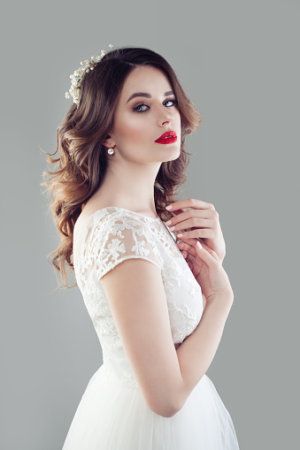 Cute Bride With Makeup And Bridal Hairstyle Wearing White Wedding Dress  Stock Photo - Download Image Now - iStock
