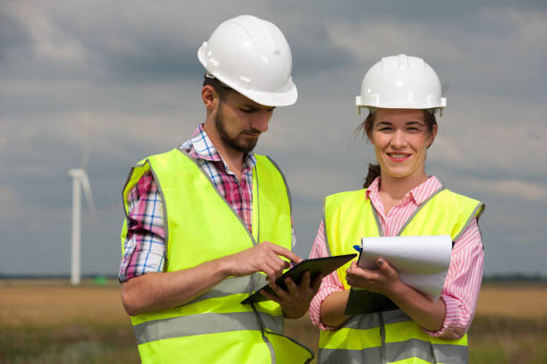 istock Concept of engineers and windmills 1069936712