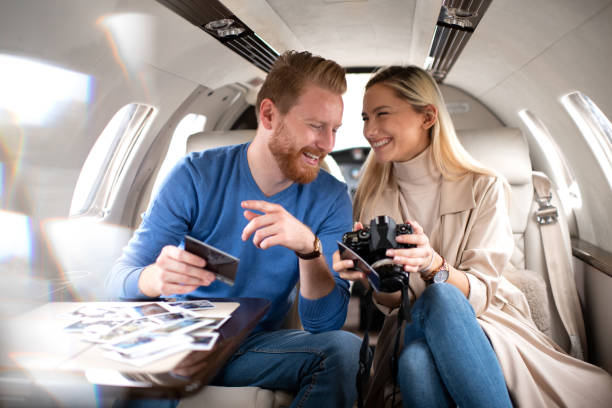 istock Young rich couple inside a private airplane 1069936790