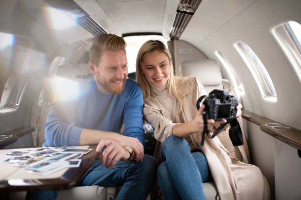 istock Young rich couple taking a selfie inside a private airplane 1069937952