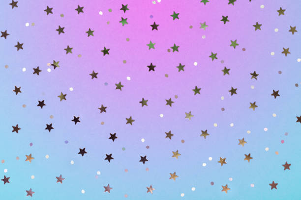 istock Christmas pattern made of silver stars on blue background. Winter concept. Flat lay. 1069938418