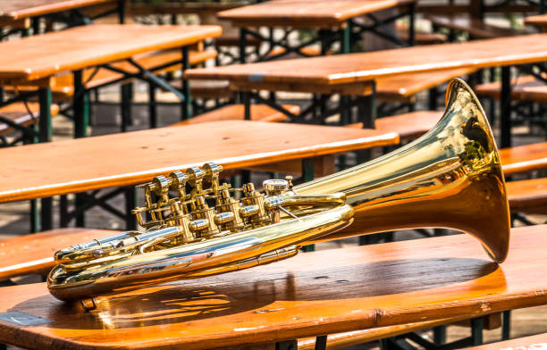 part of a typical bavarian brass instrument part of a typical bavarian brass instrument - photo dirndl traditional clothing austria traditional culture stock pictures, royalty-free photos & images