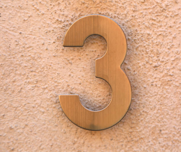 istock text number 3 in golden metal 1069942708