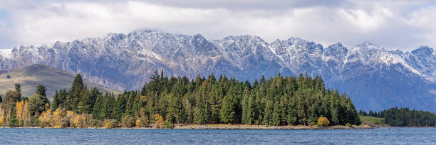 istock Green Forest Across A Lake 1069942960