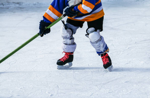 istock Kids at ice hockey practice. 1069944412