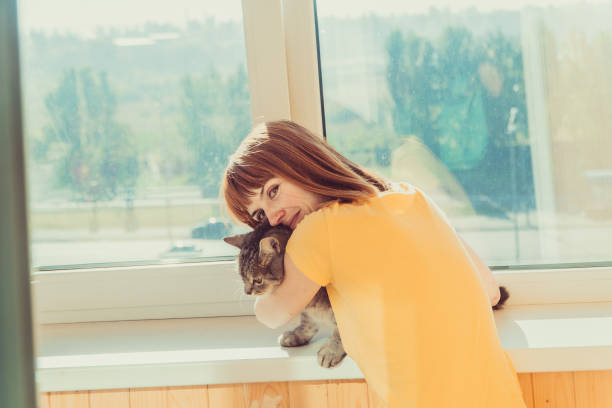 istock Cat. Girl hugging a cat 1069946242