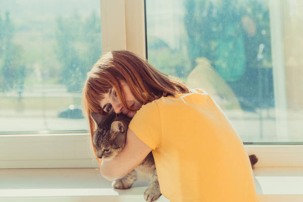 istock Cat. Girl hugging a cat 1069946272
