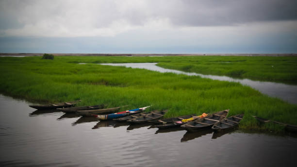 panorama with Boats on the Nokoue lake, Benin panorama with Boats on the Nokoue lake in Benin benin stock pictures, royalty-free photos & images