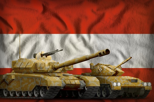 tanks with orange camouflage on the Austria flag background. Austria tank forces concept. 3d Illustration