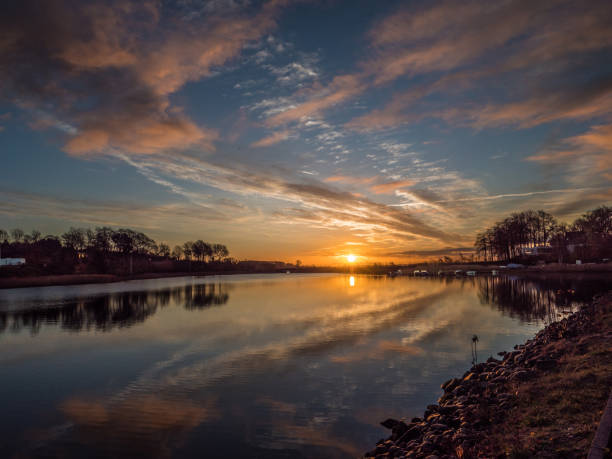 istock Image of a marina with water reflection and dramatic sky. 1069951966