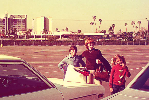 Vintage family photo on a sunny winter day Vintage image of a mother and her children on a sunny day 1970s woman stock pictures, royalty-free photos & images