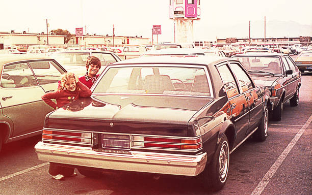istock Vintage kids at a parking lot. 1069952132