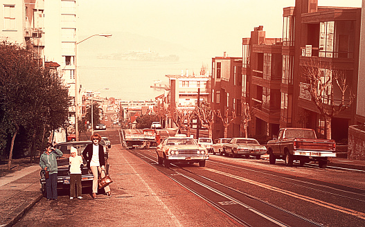 Vintage image of a mother and her children on the streets inSan Francisco in seventies/eighties of the 20th century.