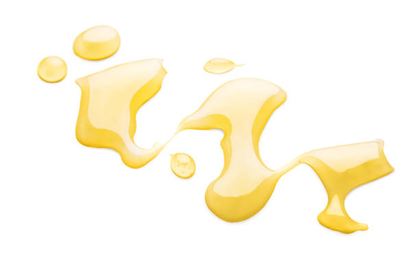 istock Sweet honey smear isolated on white background 1069952420