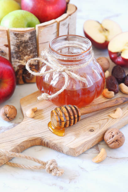 istock Apples, walnut, dried fruit and honey 1069952424