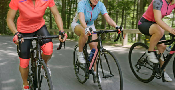 istock Three women riding road bikes on mountain road 1069952834
