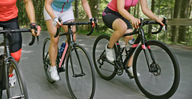 istock Three women riding road bikes on mountain road 1069952840