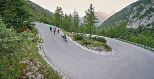 istock Group of road cyclists riding up mountain road 1069952886