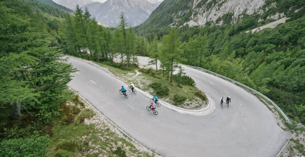istock Group of road cyclists riding up mountain road 1069952894