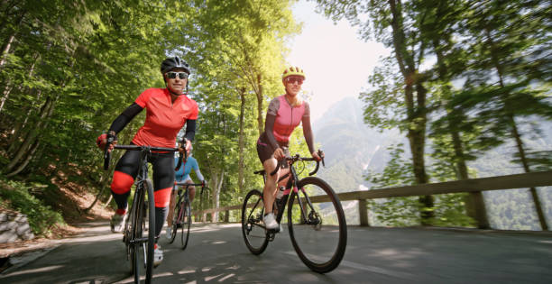 istock Three women riding road bikes on mountain road 1069953168