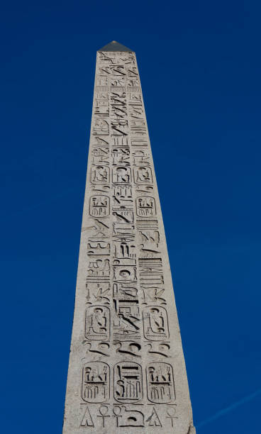 istock Luxor Obelisk - Ancient Egyptian granite obelisk, originally from Luxor, with hieroglyphs and a gold-leafed top. Place de la Concorde, Paris 1069956198