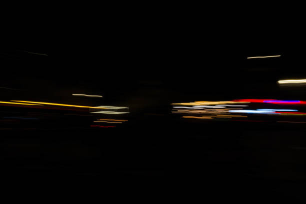 istock Slurred and stretched street lights in Paris at night 1069956284