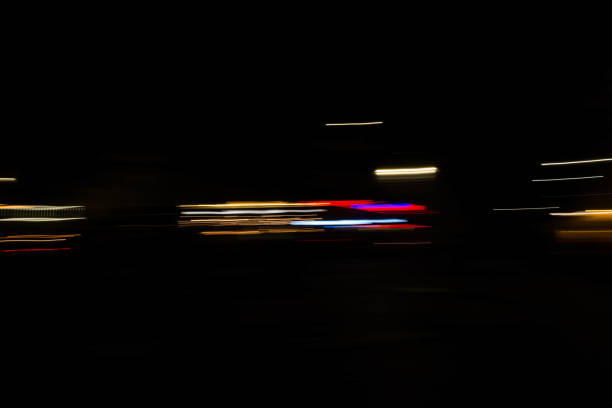 istock Slurred and stretched street lights in Paris at night 1069956308