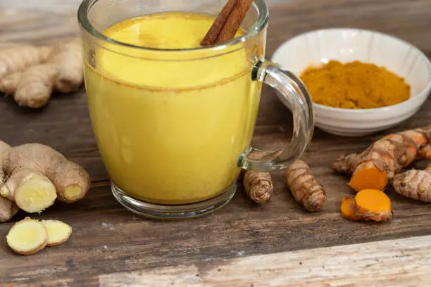 Photo of Golden milk with fresh ginger and turmeric