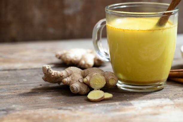 istock Glass with golden milk 1069956786