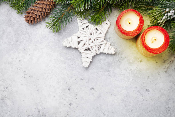 istock Christmas decor, candles and fir tree branch 1069958222