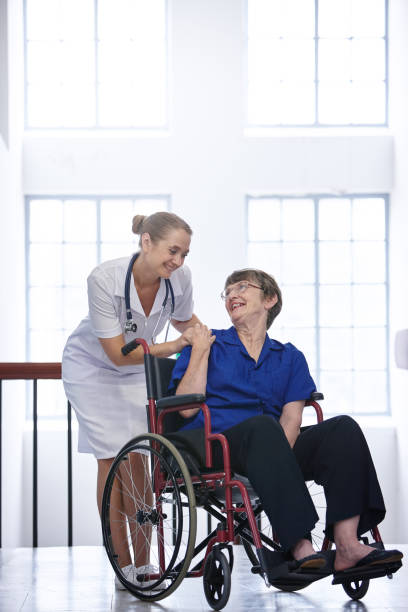 istock Nurse and elderly patient share a tender moment 1069961030