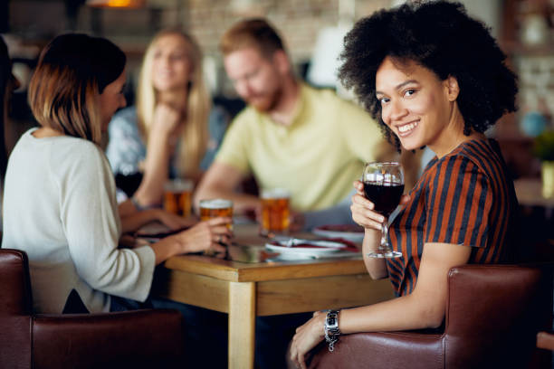 istock Woman  glass of wine. 1069965178