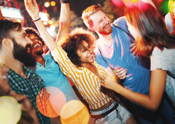 istock Friends dancing at a concert. 1069968312