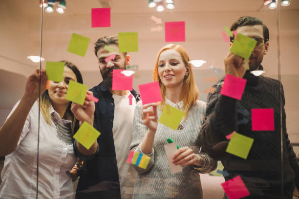 istock Giving motivational sticky notes to out team 1069970536