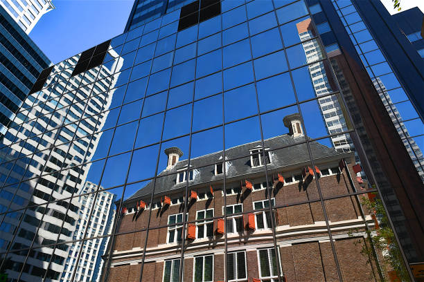 Trinity church reflected in the modern facade of a skyscraper tower (Boston, Massachusetts).