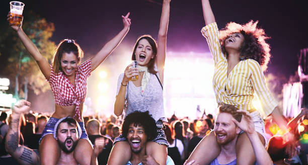 istock Friends dancing at a concert. 1069974830