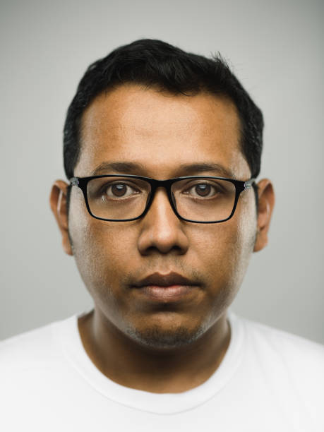 istock Real malaysian young adult man with blank expression 1069975432