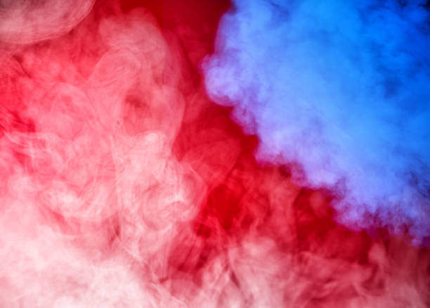 istock colorful smoke red blue gray 1069977154